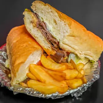 Sandwich with meat and a side of fries